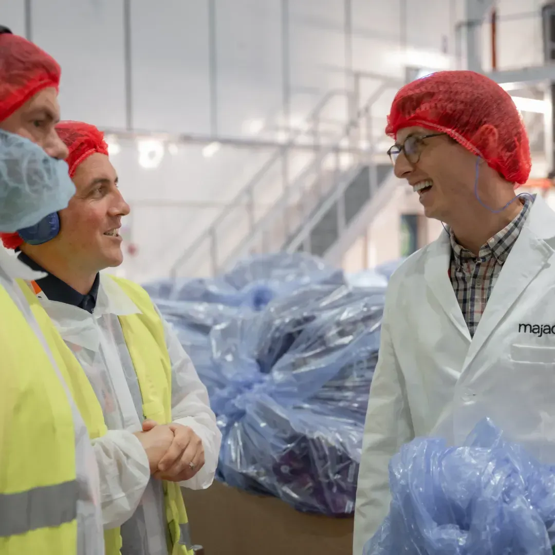 majaco and WARP Snacks team members on the packing line